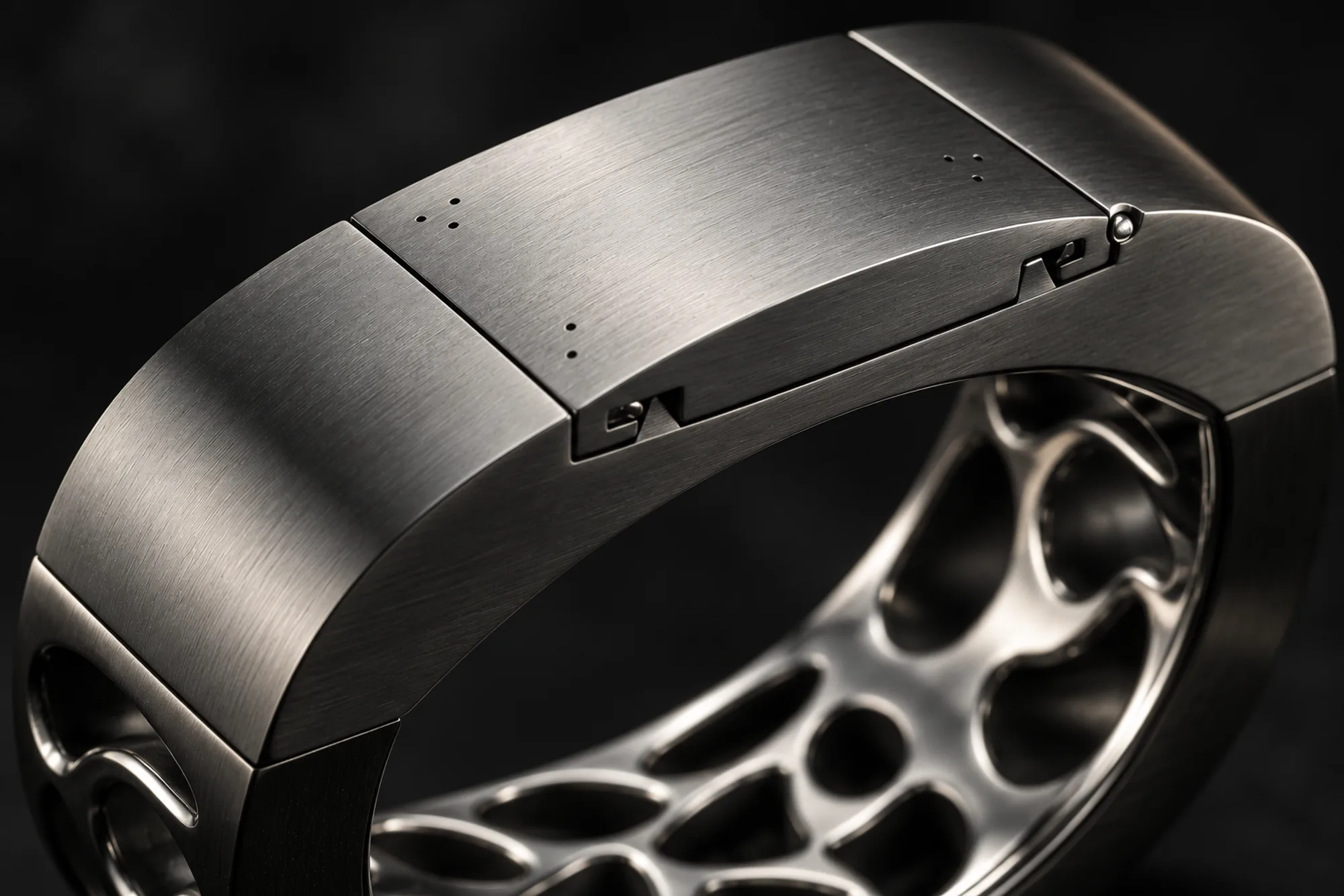AI-assisted render based on the original design — Macro of the SILLAGE hinged diffuser panel with micro-perforations, latch and brushed gunmetal band texture beside the polished lattice.